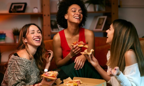 3 women eating food