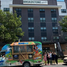 a Kona Ice truck with people in front of Broadstone North ATX a Kona Ice truck with people in front of Broadstone North ATX