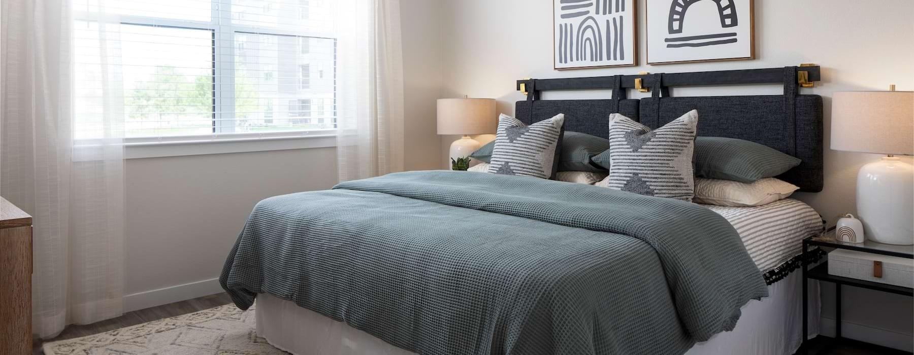 a bed with pillows and a blanket